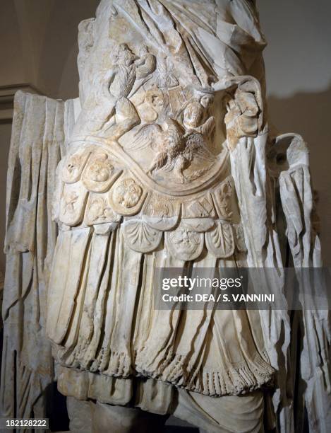 Statue with lorica decorated with figures of conquered barbarians, detail from the Augusteo Roman statues from Roselle, Tuscany, Italy. Roman...