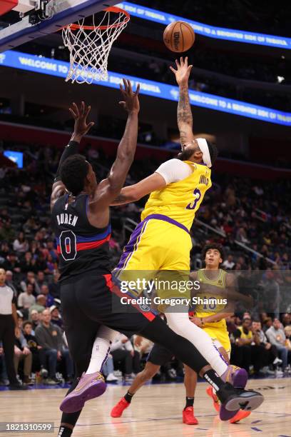 Anthony Davis of the Los Angeles Lakers takes a first half shot over Jalen Duren of the Detroit Pistons at Little Caesars Arena on November 29, 2023...