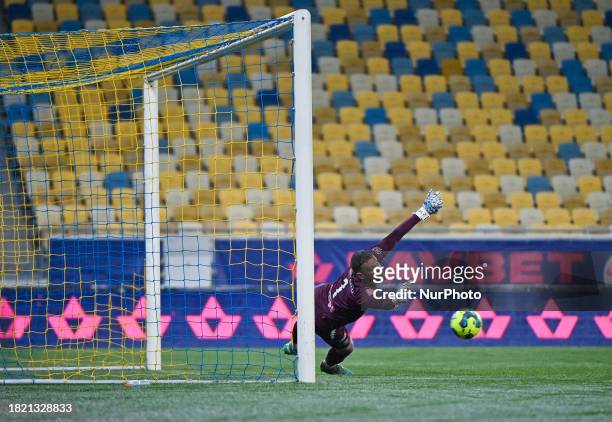In Lviv, Ukraine, on December 3 Denys Sydorenko, the goalkeeper of FC Metalist 1925 Kharkiv, is attempting to catch the ball during the 16th round...