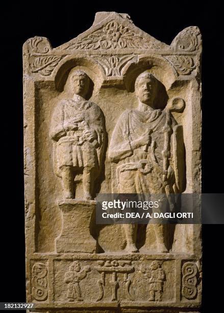 Stele of the buccinator Aurelio Bitone with shield and horn, portrait beside his son in military dress reflecting the hereditary nature of service,...