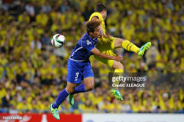 Cristiano of Kashiwa Reysol and Kodai Watanabe of Montedio Yamagata compete for the ball during the J.League J1 second stage match between Kashiwa...