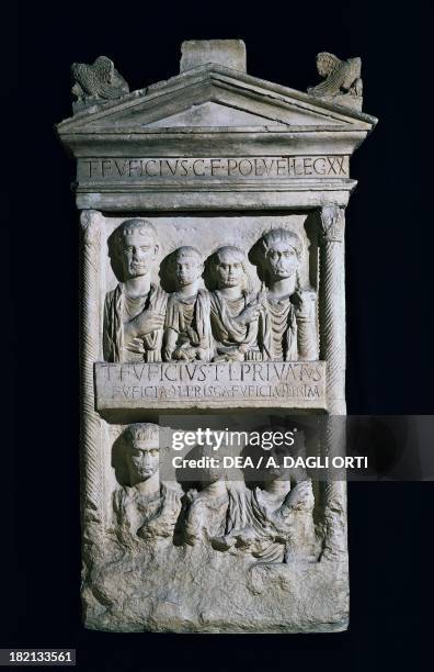 Polyconic stele for the Gens Fuficia, depicting Titus Fuficius veteran of the XX legion with his family and freedmen of the family, artefact...