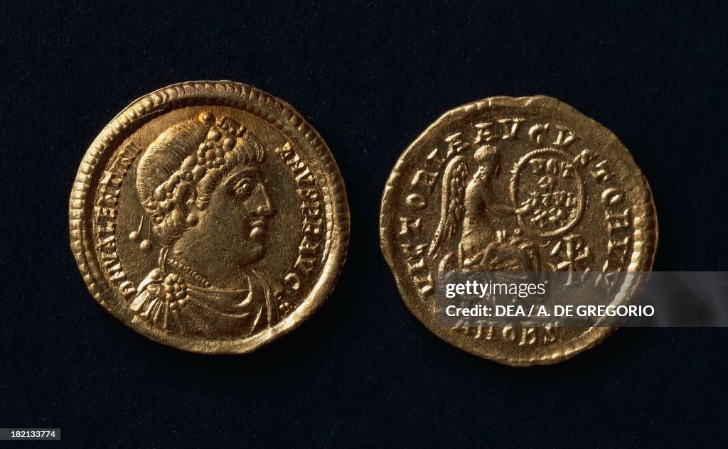 Valentinian Coin Valentinian I coin bearing the image of the emperor and a winged ...