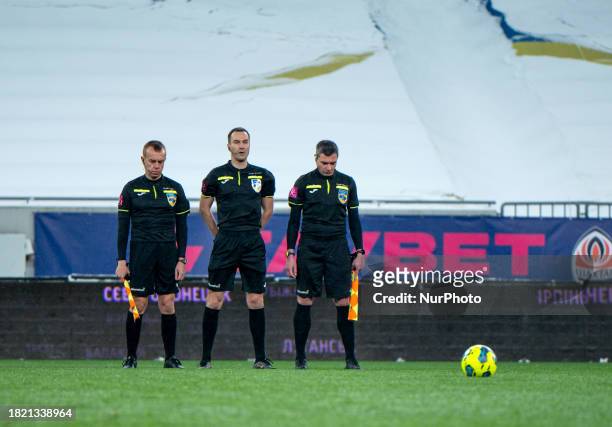 Referees are standing on the pitch before the start of the 2023/2024 Ukrainian Premier League 16th Round game between FC Shakhtar Donetsk and FC...