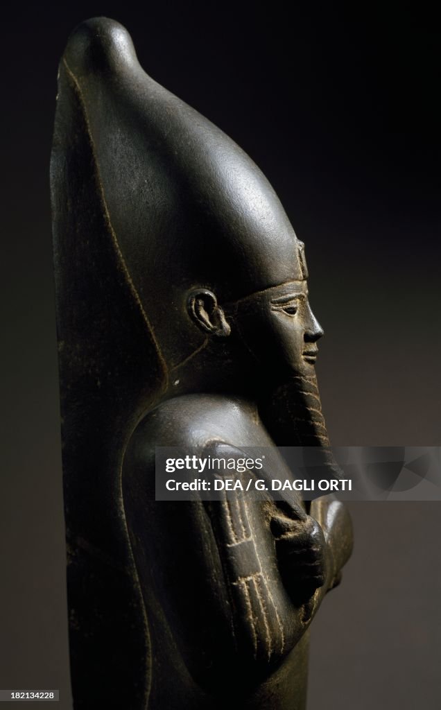 Mummified statue of the god Osiris...