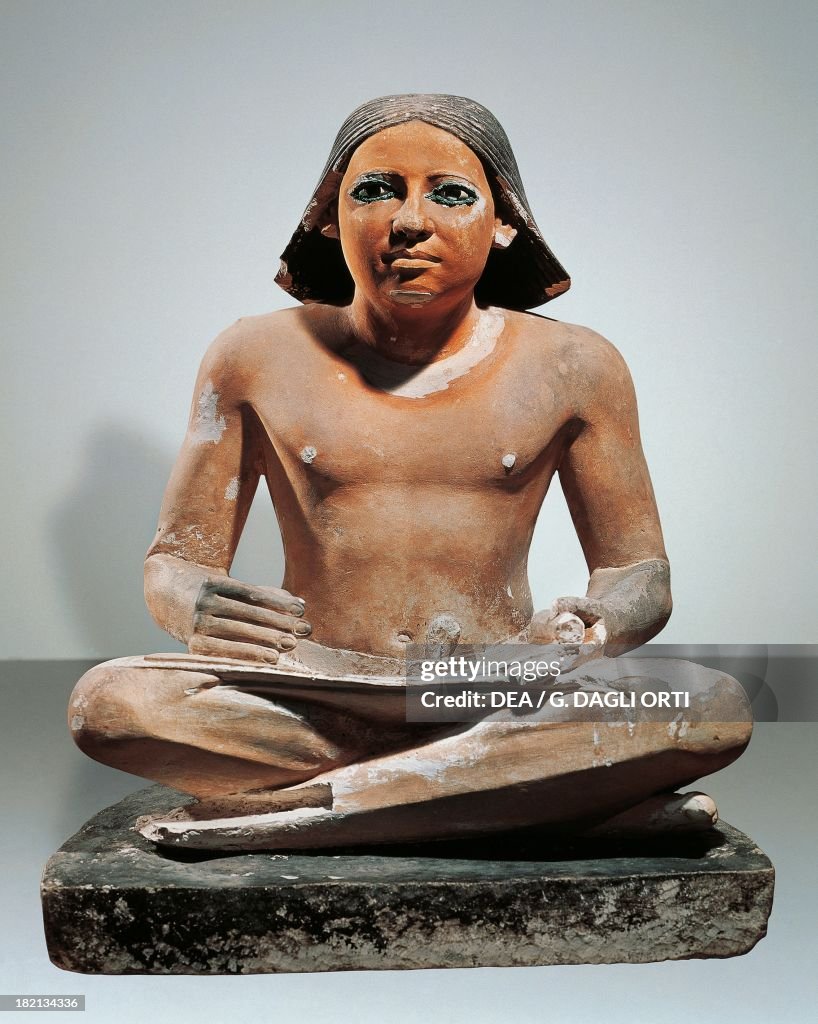 Scribe holding a papyrus...