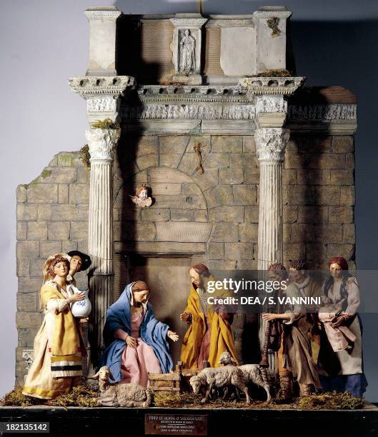 Nativity, nativity scene set at the Forum of Nerva or Colonnacce in Rome, with Neapolitan figurines from the 18th century, sketch by Mario de Carlo,...