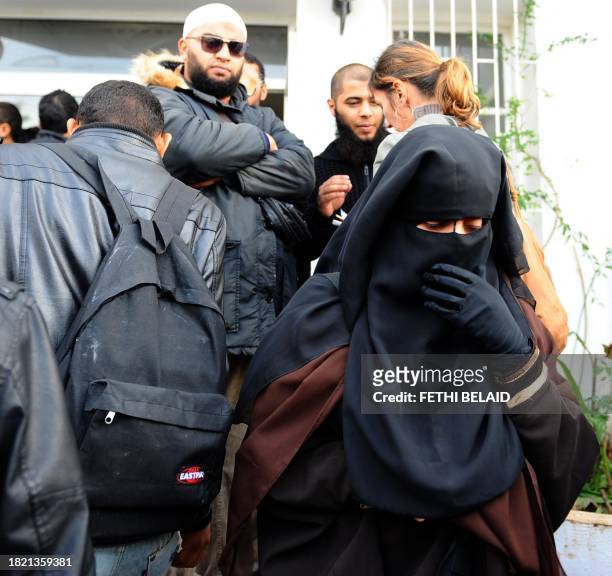 Student, wearing niqabs, leave on November 29, 2011 the building housing the office of the dean of the Faculty of Arts at the University of Manuba,...