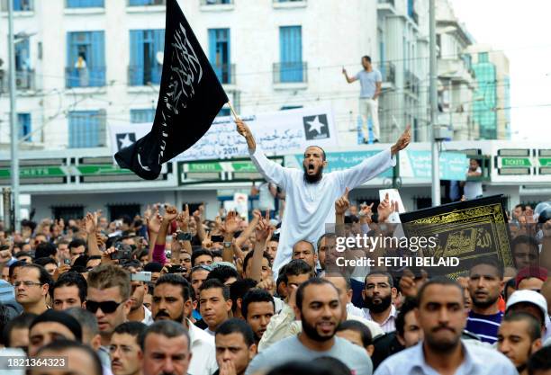 People demonstrate in front of the private Nessma TV station headquarters on October 14, 2011 in Tunis. On October 9 a mob of Salafists tried to...