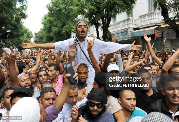 People demonstrate in front of the private Nessma TV station headquarters on October 14, 2011 in Tunis. On October 9 a mob of Salafists tried to...