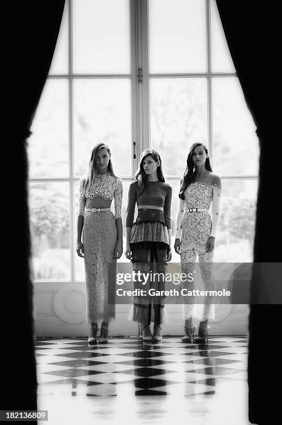 Models pose during the Alessandra Rich presentation at the British Ambassador's residence as part of Paris Fashion Week Womenswear Spring/Summer 2014...