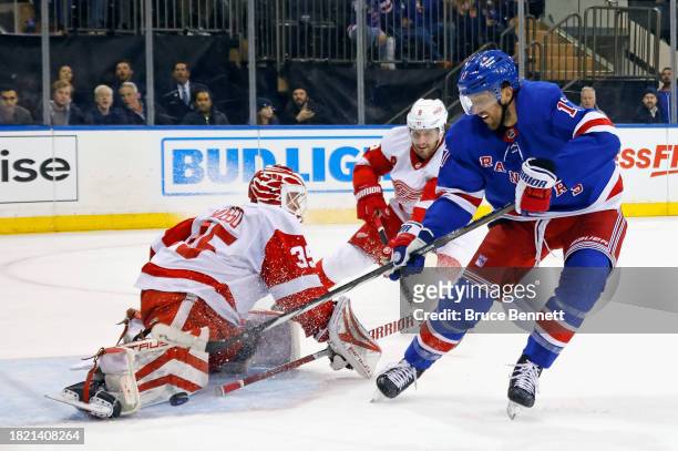 Ville Husso of the Detroit Red Wings makes the second period save on Blake Wheeler of the New York Rangers at Madison Square Garden on November 29,...