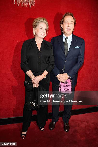 Catherine Deneuve and Gilles Dufour attend the Jean Paul Gaultier show as part of the Paris Fashion Week Womenswear Spring/Summer 2014 on September...