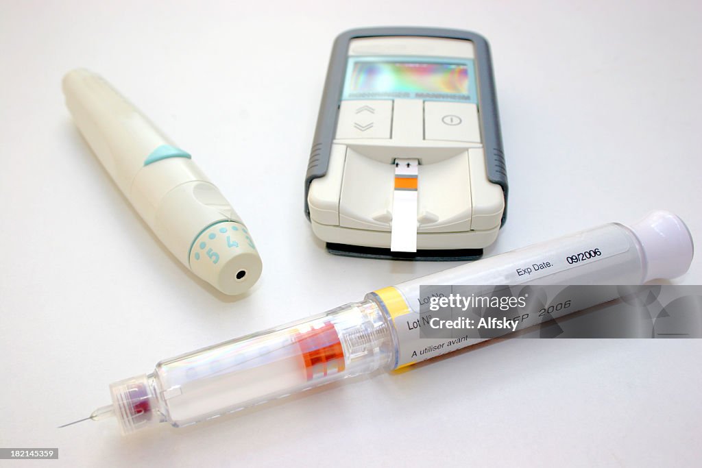 Diabetic treatment items - syringe, insulin and blood tester