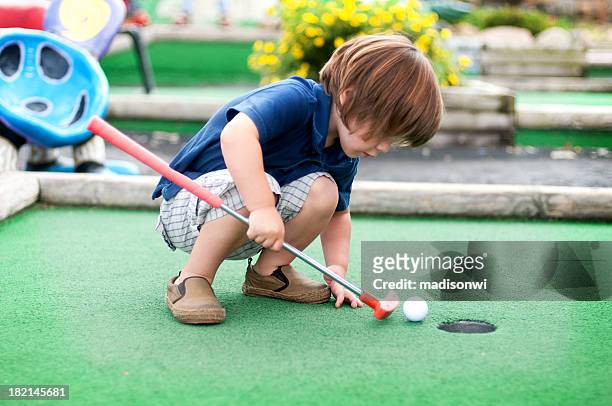 mini golf - golf putter stock pictures, royalty-free photos & images