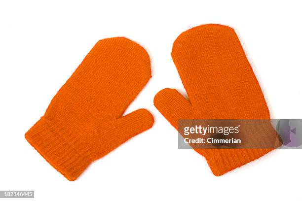 orange mittens on white - orange glove stock pictures, royalty-free photos & images