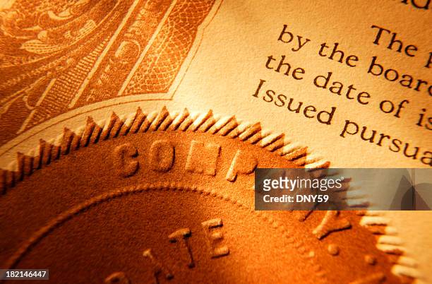 close up of a company seal on old stock certificate - mutual fund stock pictures, royalty-free photos & images