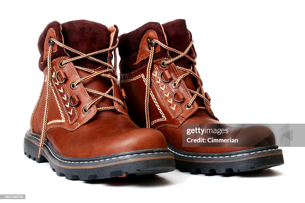 Pair of new brown leather boots with fabric trim