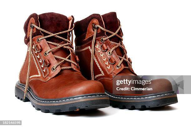 pair of new brown leather boots with fabric trim - brown shoe stock pictures, royalty-free photos & images