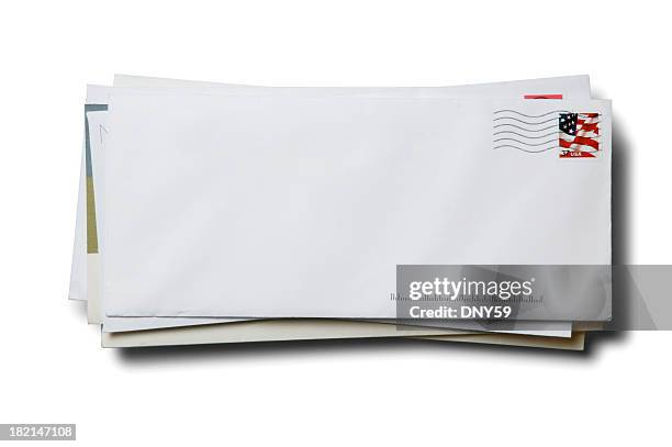 stack of business envelopes with cancelled stamp on white background - mail stock pictures, royalty-free photos & images