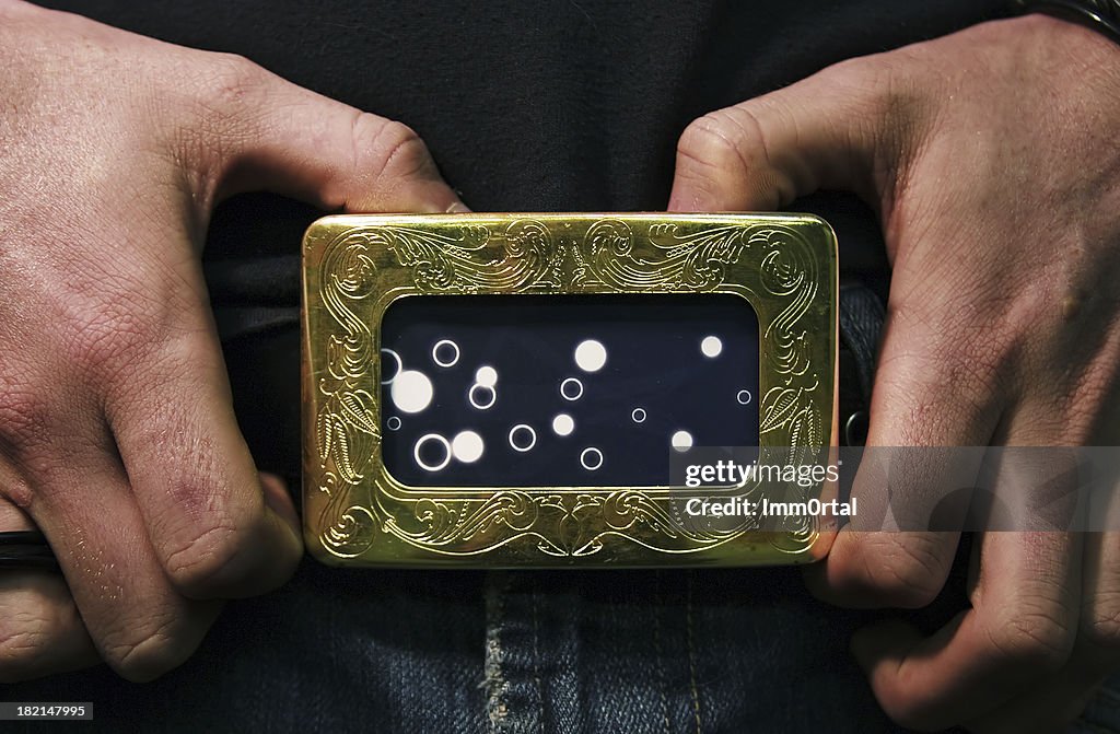 Hands on belt buckle