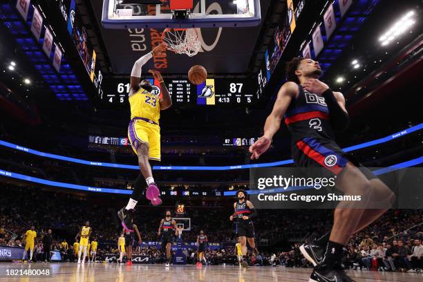 LeBron James of the Los Angeles Lakers dunks in the second half while playing the Detroit Pistons at Little Caesars Arena on November 29, 2023 in...