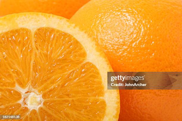 close up of cross section of orange - macro stockfoto's en -beelden