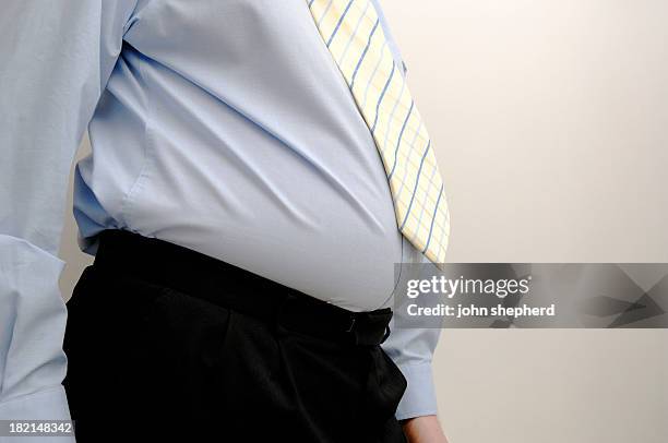 overweight businessman, stomach bulging - bulging belly stock pictures, royalty-free photos & images