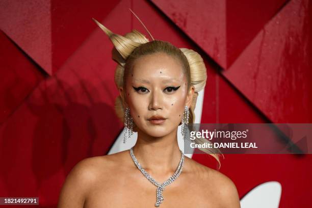 Businesswoman and model Betty Bachz poses on the red carpet upon arrival at The 2023 Fashion Awards at the Royal Albert Hall, in London, on December...