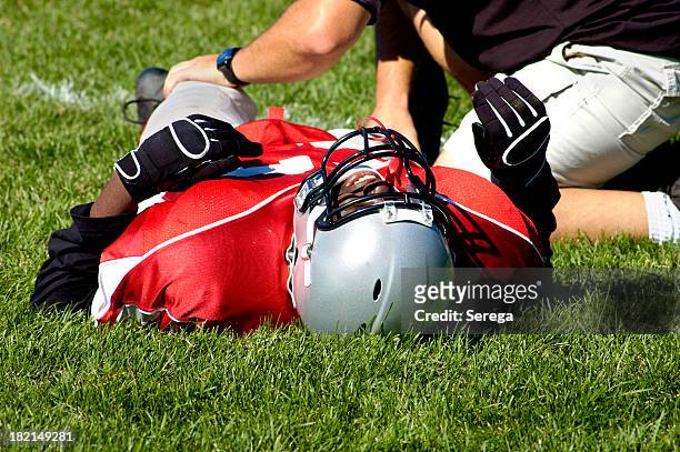 pain in a game - american football sport stock pictures, royalty-free photos & images