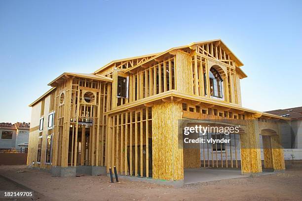 framed house under construction - house construction frame stock pictures, royalty-free photos & images