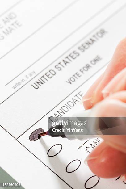 congress voting ballot with hand filling in the vote - voting ballot stock pictures, royalty-free photos & images