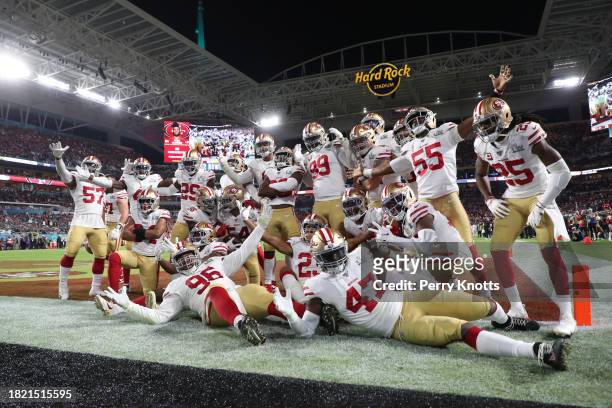 The San Francisco 49ers defense pose for a photo after a Fred Warner interception against the Kansas City Chiefs during Super Bowl LIV at Hard Rock...