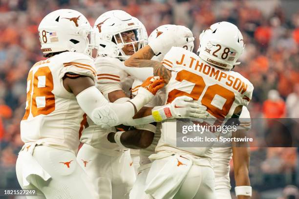 Texas Longhorns defense celebrates an interception during the Big 12 Championship game between the Texas Longhorns and the Oklahoma State Cowboys on...