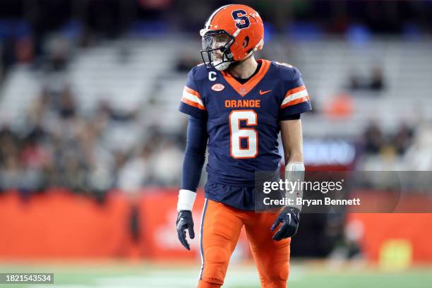 Garrett Shrader of the Syracuse Orange lines up during the fourth quarter against the Wake Forest Demon Deacons at JMA Wireless Dome on November 25,...