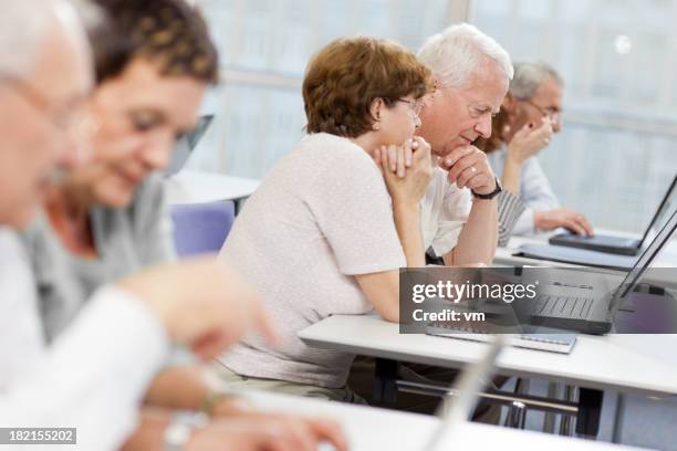 computer workshop for seniors - senior men computer stock pictures, royalty-free photos & images