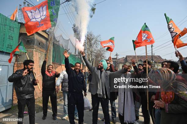 Leaders and supporters Bharatiya Janata Party burn firecrackers to celebrate the victory in the Madhya Pradesh, Chhattisgarh, and Rajasthan Assembly...