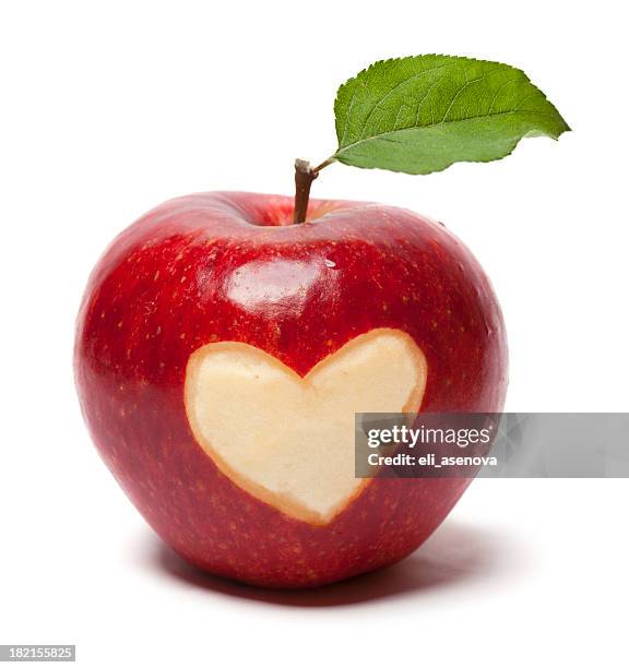 fresh red apple with heart symbol and leaf - apple heart stock pictures, royalty-free photos & images