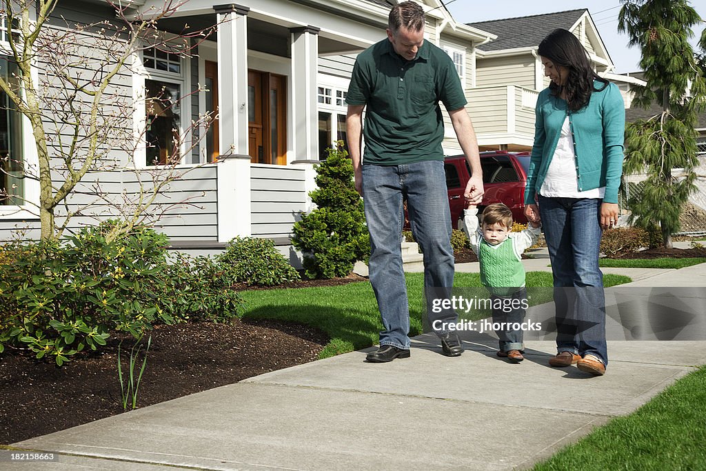 Go Strolling Young Family Taking A Stroll High-Res Stock Photo - Getty Images