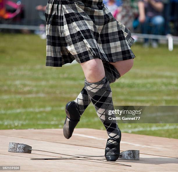 scottish sword dancer - kilt stock pictures, royalty-free photos & images