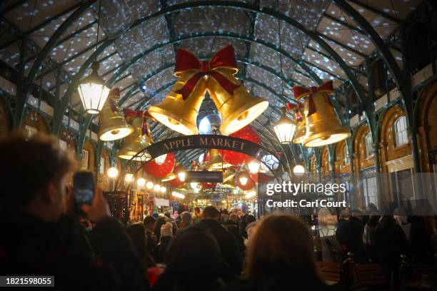 Christmas lights are displayed in Covent Garden market on December 04, 2023 in London, England.