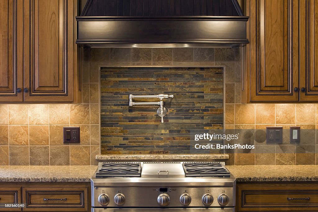 Stainless Residential Kitchen Range with Pot Faucet, Tile & Cabinets