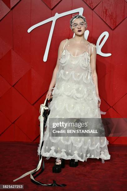 British actress Maisie Williams poses on the red carpet upon arrival at The 2023 Fashion Awards at the Royal Albert Hall, in London, on December 4,...