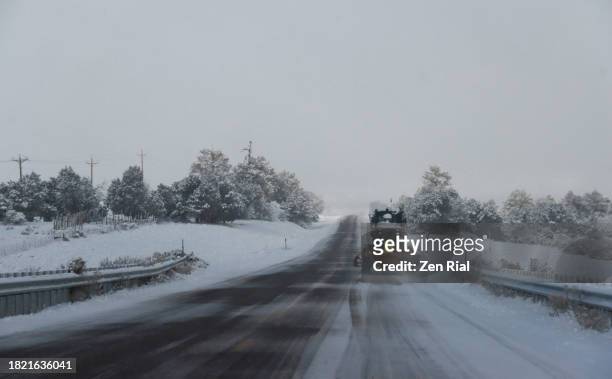 snowplow cleaning road after a snowstorm in zion national park - utah flag stock pictures, royalty-free photos & images