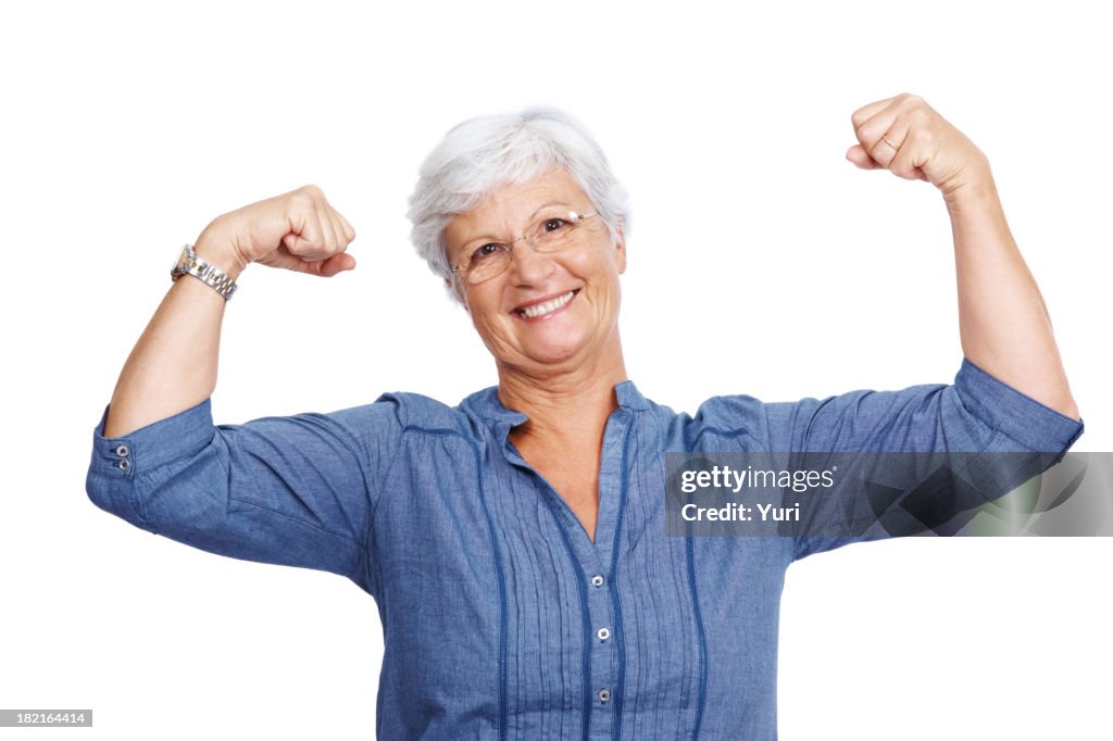 Fit senior female showing her biceps