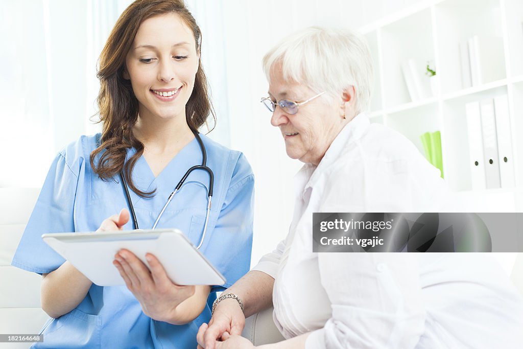 Doctor Explaining Medical Exam Results to senior patient.