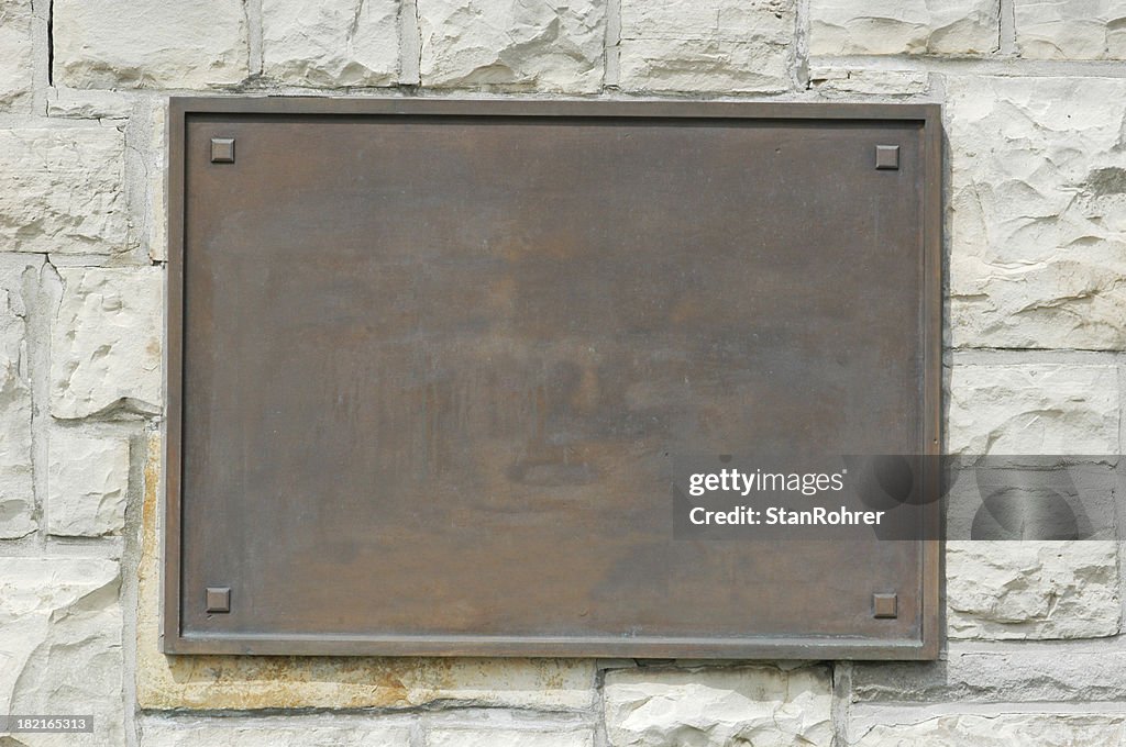 Bronze Memorial Plaque On Stone Wall
