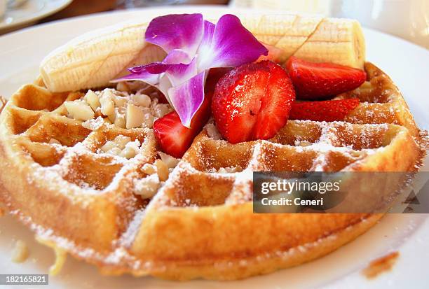 tropical belgian waffle breakfast with fruit and macadamia nuts - belgium waffles stock pictures, royalty-free photos & images