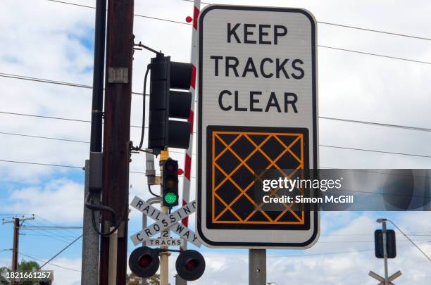 'keep tracks clear' railway crossing road warning sign - adelaide road stock pictures, royalty-free photos & images