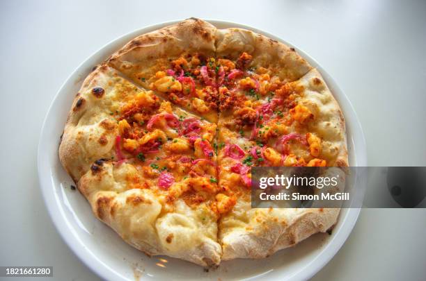 Prawn Nduja Spicy Spreadable Pork Sausage And Pickled Shallot Sourdough Wood Fired Pizza On A Plate High-Res Stock Photo